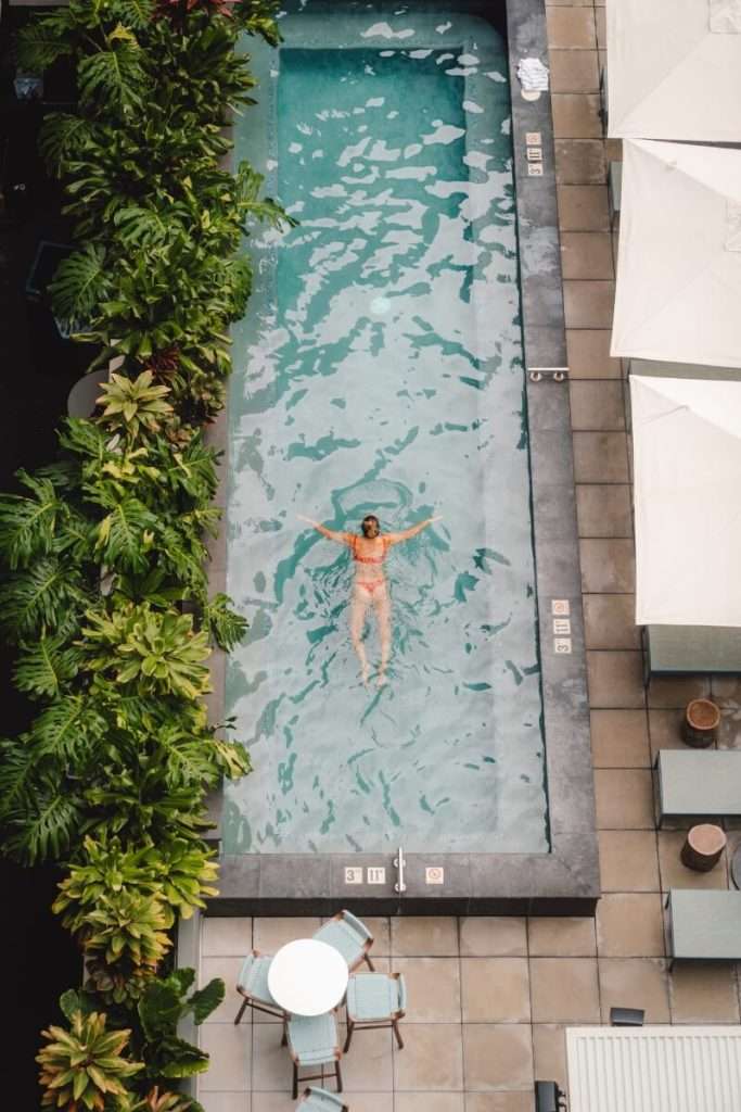 girl swimming in hawaii romer house pool